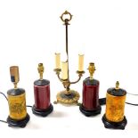 A Georgian style brass three branch table lamp, raised on paw feet, 52cm high, together with two pai