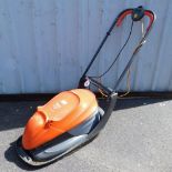 A Flymo Easy Glide 300 electric lawn mower.