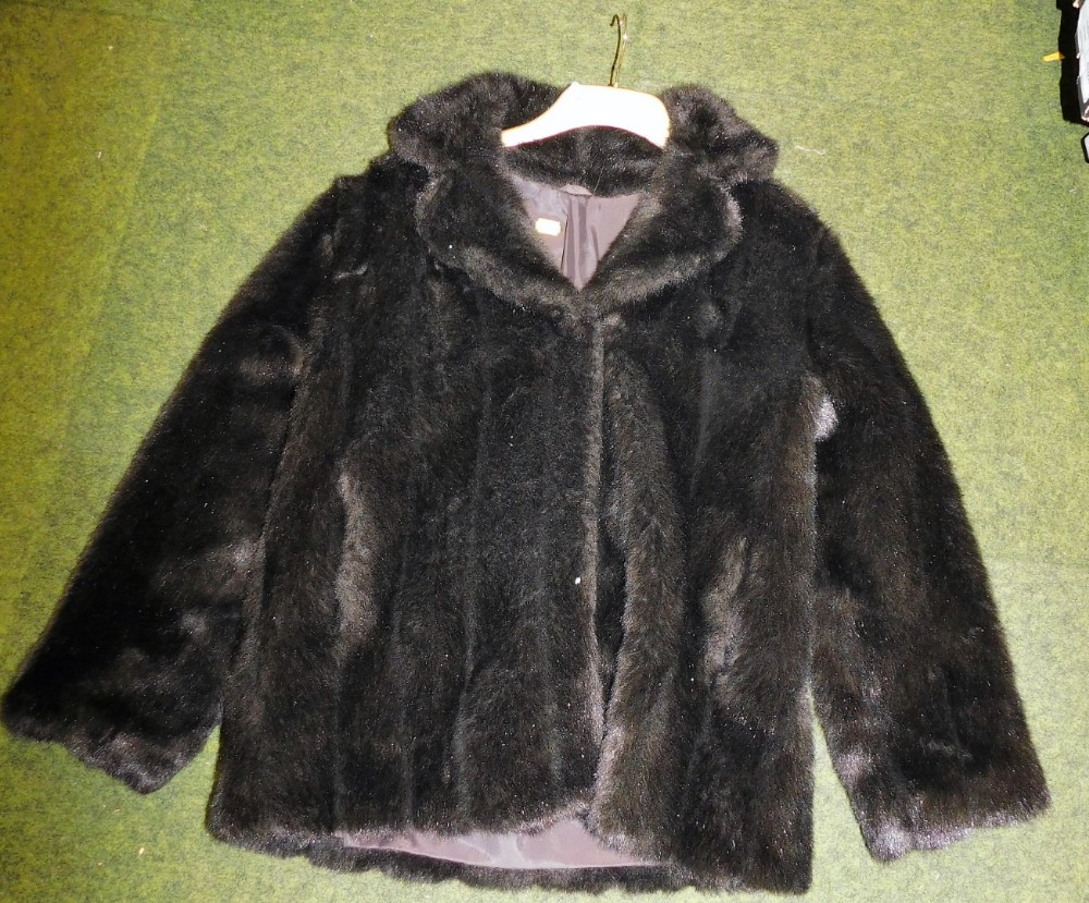 A brown faux fur short jacket, underarm measurement 48cm.