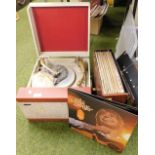 A Pilot Encore portable record player, together with a quantity of LP records.