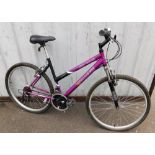 A Challenge Silver Canyon mountain bike, in purple and black trim.