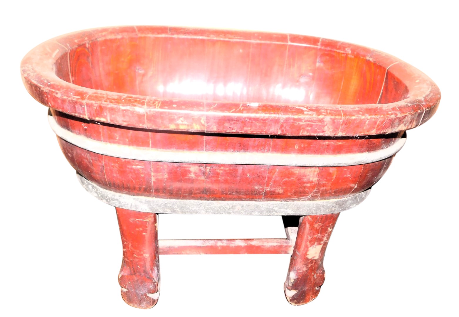 A Chinese wooden washbowl, with coopered bands, on tapering feet, 55cm wide.