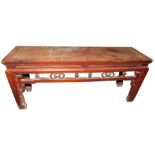 A late 19th/early 20thC Chinese elm low table or bench, of rectangular form, with pierced and carved