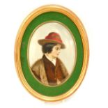 A Berlin KPM porcelain oval plaque, painted with a male figure, in fur coat and hat, with a green ba