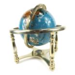 A gemstone inset small tabletop globe, 28cm high, the base 20cm x 20cm.