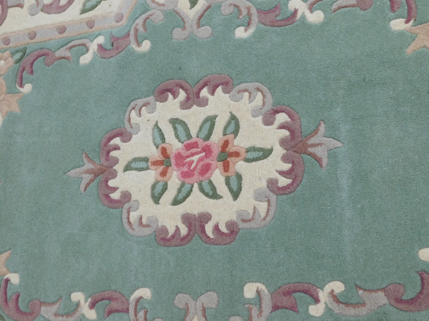 A pair of Chinese sea green ground rugs, with floral decoration, each 178cm x 118cm. - Image 2 of 3