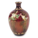 A Fielding's Crown Devon Sylvan Lustrine pottery vase, decorated with butterflies and trees against