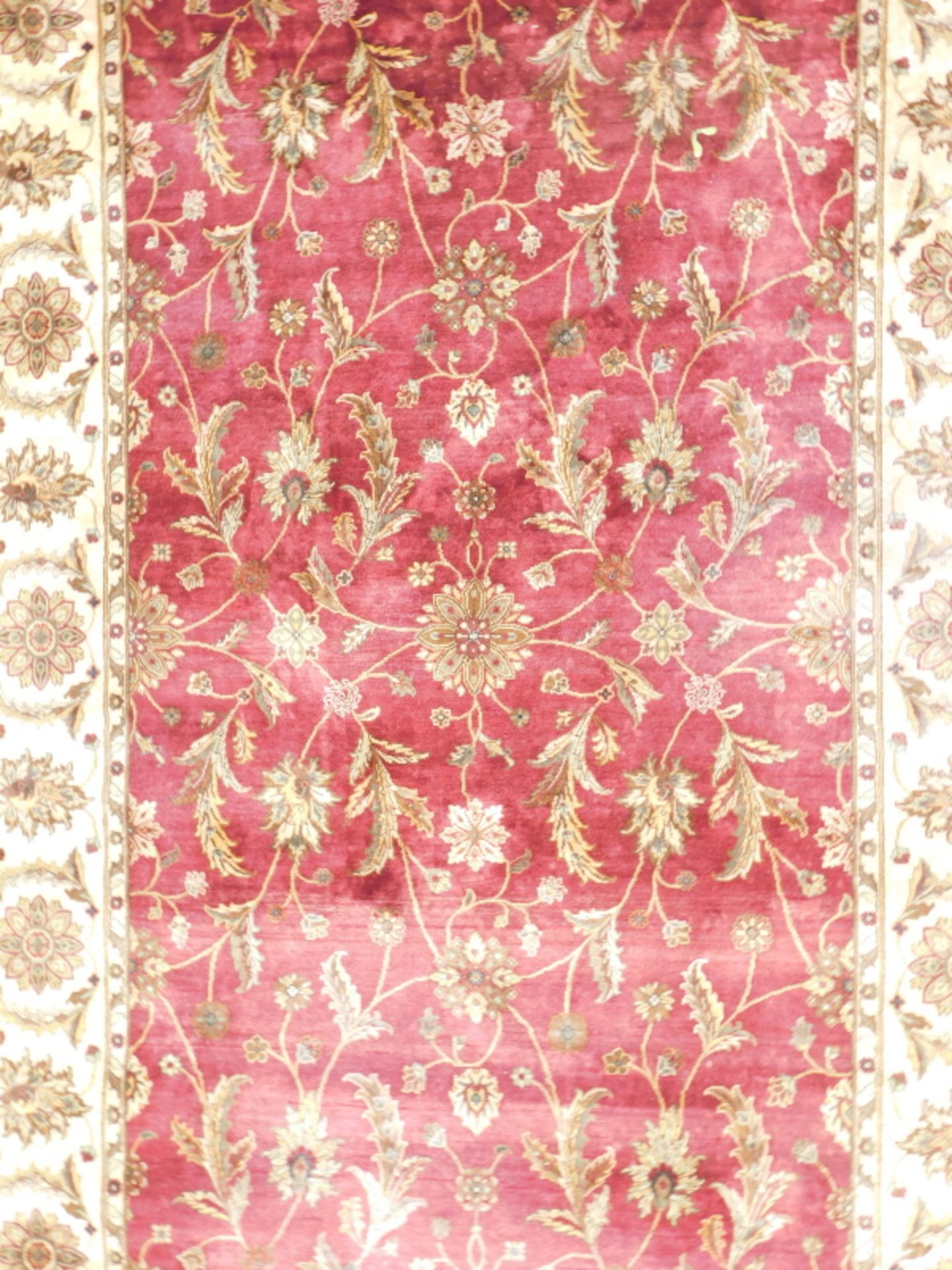 A machine woven silk and cotton Indian rug, with a Persian design of flowers, roundels, in deep red - Image 2 of 4