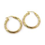 A pair of 9ct gold hoop earrings, each with pierced design, 2.5cm wide, 2.4g.