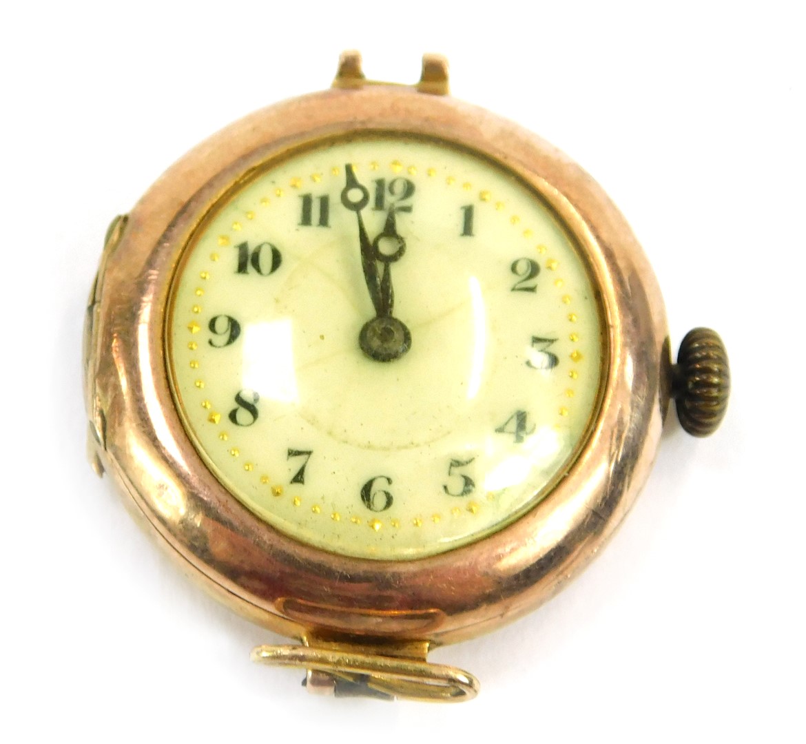 A 9ct gold cased wristwatch head, with white enamel numeric dial with gold outer pointers, 11.7g all
