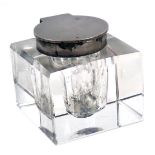 A glass inkwell, of square form, with plated hinged cap, 6cm high.