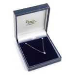 An 18ct white gold diamond pendant and earring set, with teardrop shaped diamond pendant approx 0.12