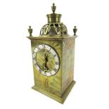 A mid 20thC brass carriage clock, the domed pierced top with urn finials, a silvered Roman numeric d