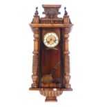 A late 19th/early 20thC walnut and beech Vienna wall clock, the dial with Roman numerals, the case w