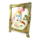 An Art Nouveau style brass photograph frame, of rectangular form with applied semi clad female motif