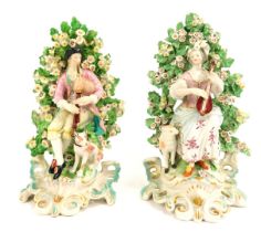 A pair of 19thC Continental porcelain figure groups in Derby style, depicting male and female playin