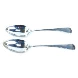 A pair of Victorian silver fiddle pattern serving spoons, each bearing the initial HEB, London 1872,