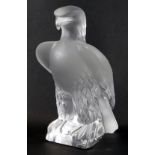 A Lalique figure of an eagle, perched on a rock, bearing signature, 23cm high.