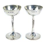 A pair of George V silver goblet shaped cups, of plain form, makers mark RP, Chester 1915, 8.2cm hig