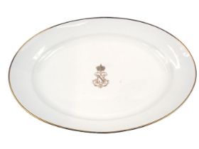 A 19thC Sevres porcelain oval meat dish, on a white ground with gilt borders and central N emblem fo