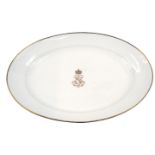 A 19thC Sevres porcelain oval meat dish, on a white ground with gilt borders and central N emblem fo