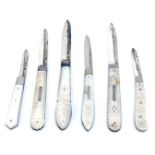 A small collection of Victorian silver fruit knives, with folding blades and mother of pearl handles