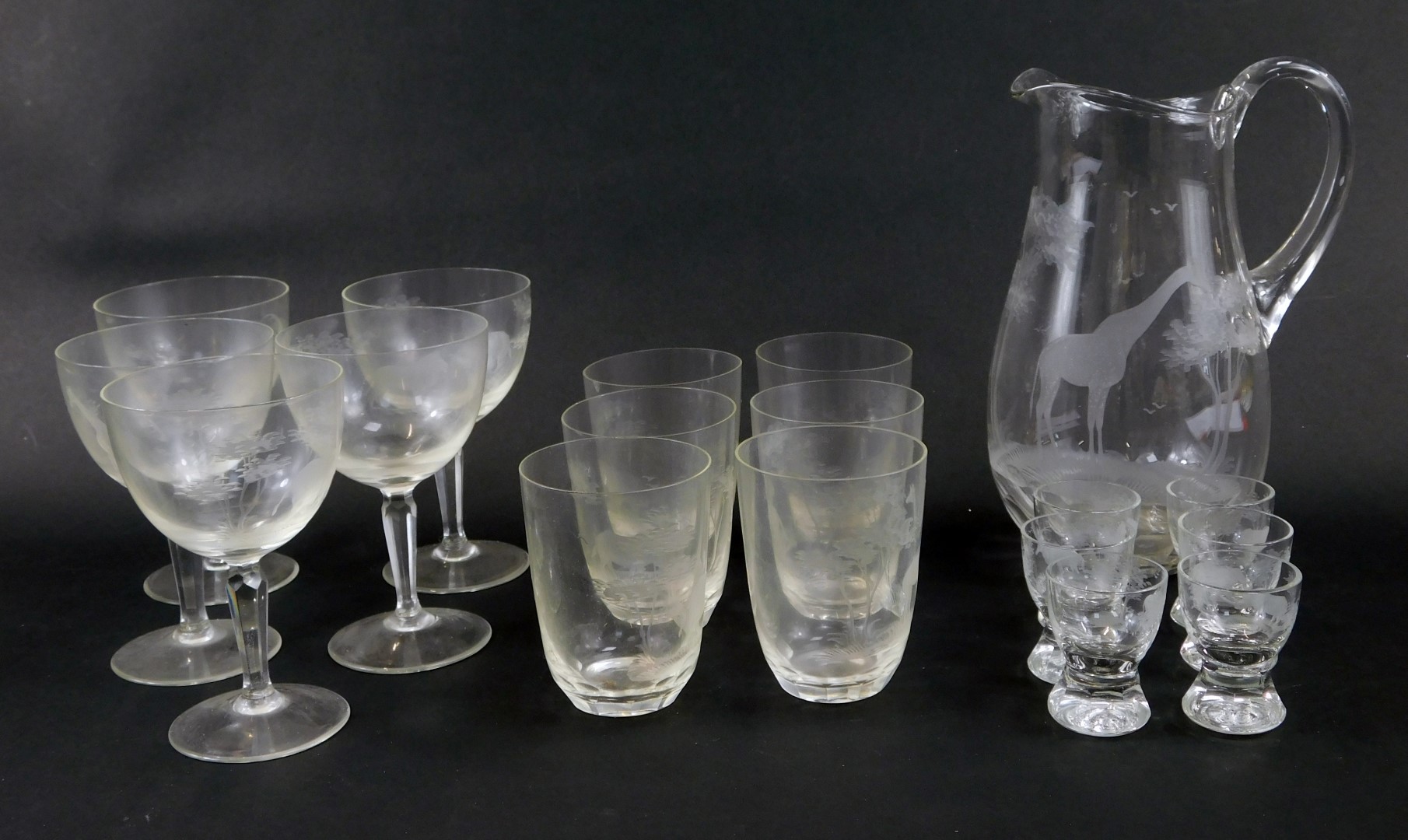 A late 19th/early 20thC suite of glass, with cut decoration of African animals, to include giraffe,