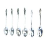Silver Apostle coffee spoons, comprising a set of four, with twisted handles, and two further bottle
