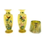 Three items of decorative glassware, comprising a Loetz style iridescent triform glass vase, with gr