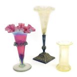 Three items of Victorian vaseline glass, comprising a green fluted stem vase, on a silver stepped ba