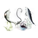 Four Murano glass fish, comprising two dolphins, each with stamp, 22cm and 29cm high, a Murano swan,