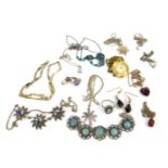 A group of costume jewellery, comprising a silver charm bracelet, pendant and chain, drop earrings,