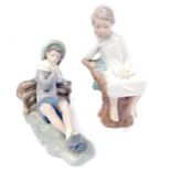 Two Lladro figures, comprising a child reading perched on tree, 21cm high, and a child reclined near