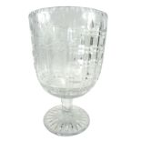 A mid 20thC cut glass goblet, with central etched glass panel of grapes and vines, on a circular foo