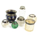 Seven silver rimmed and glass ware items, comprising an imitation tortoiseshell topped jar, four gla