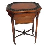 A Victorian mahogany sewing table, the hinged octagonal lid with a border carved with leaves, openin