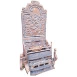 A 19thC steel fire grate, with cast iron back, decorated with Neptune, etc., the grate with pierced