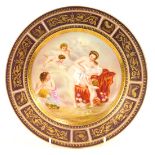 A early 20thC Vienna porcelain cabinet plate, with a central transfer printed panel depicting female