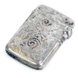 A Victorian silver vesta case, engraved with foliate scroll decoration and initialled 'W', with hing