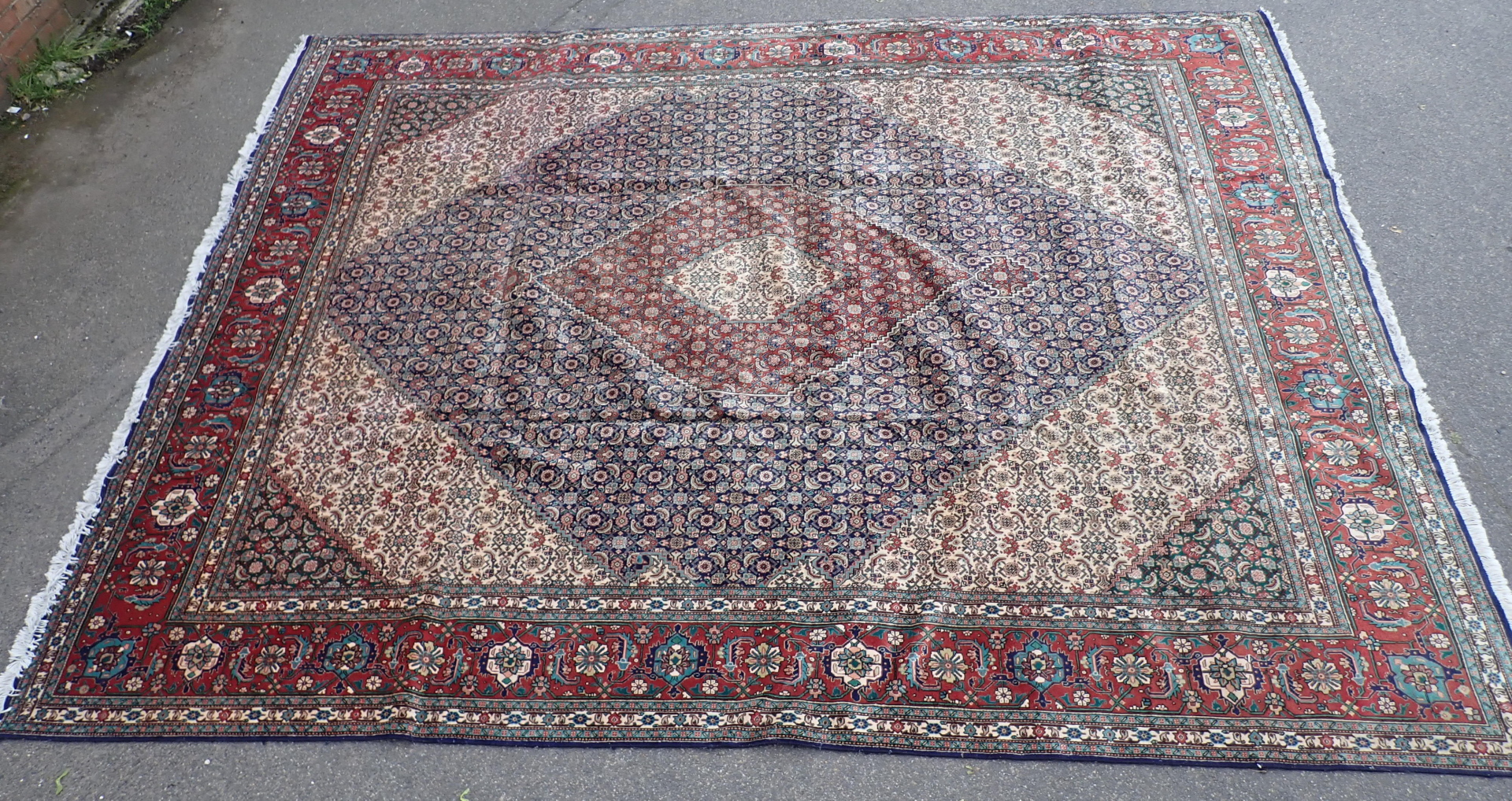 A Tabriz rug, with an all over geometric design of medallions, scrolls, roundels, on a navy ground w - Image 4 of 4