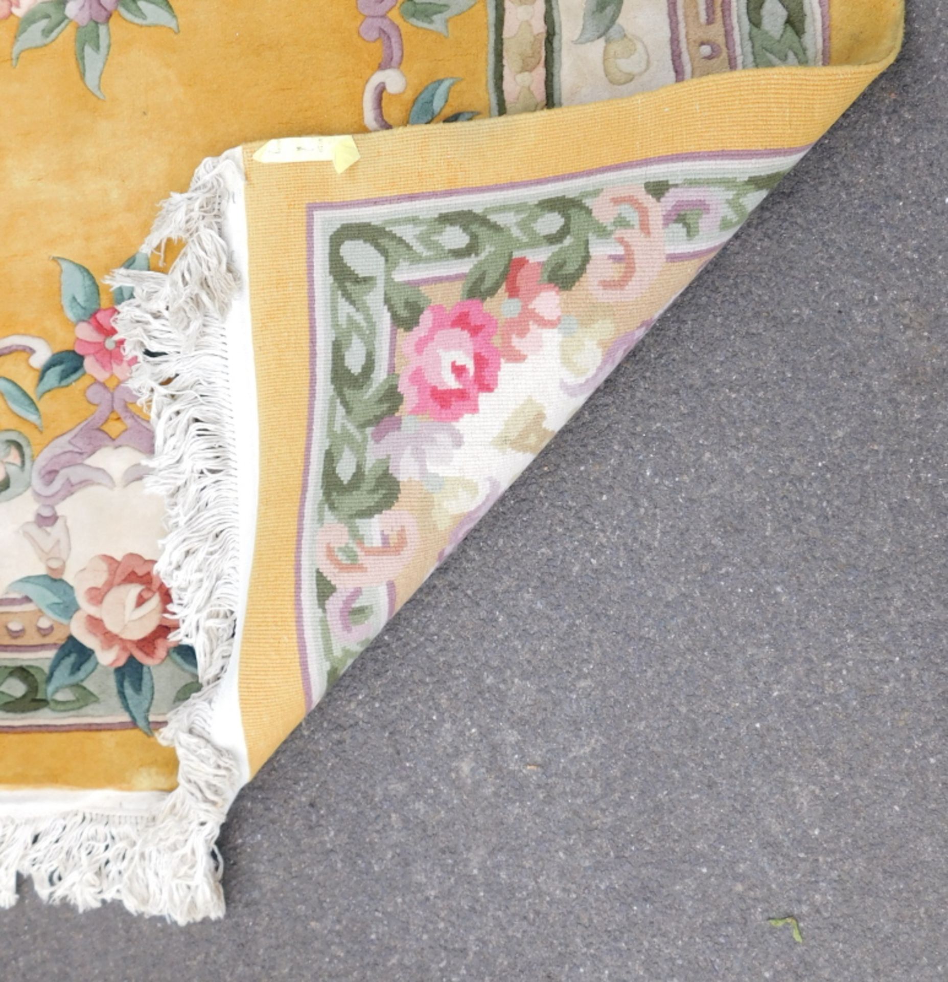 A Chinese wool cut rug, yellow ground with decorated leaf scrolls, etc, with tassel borders, togethe - Image 4 of 5
