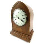 An Edwardian mantel clock, in oak case with boxwood fan inlay, with a white ceramic Roman numeric di