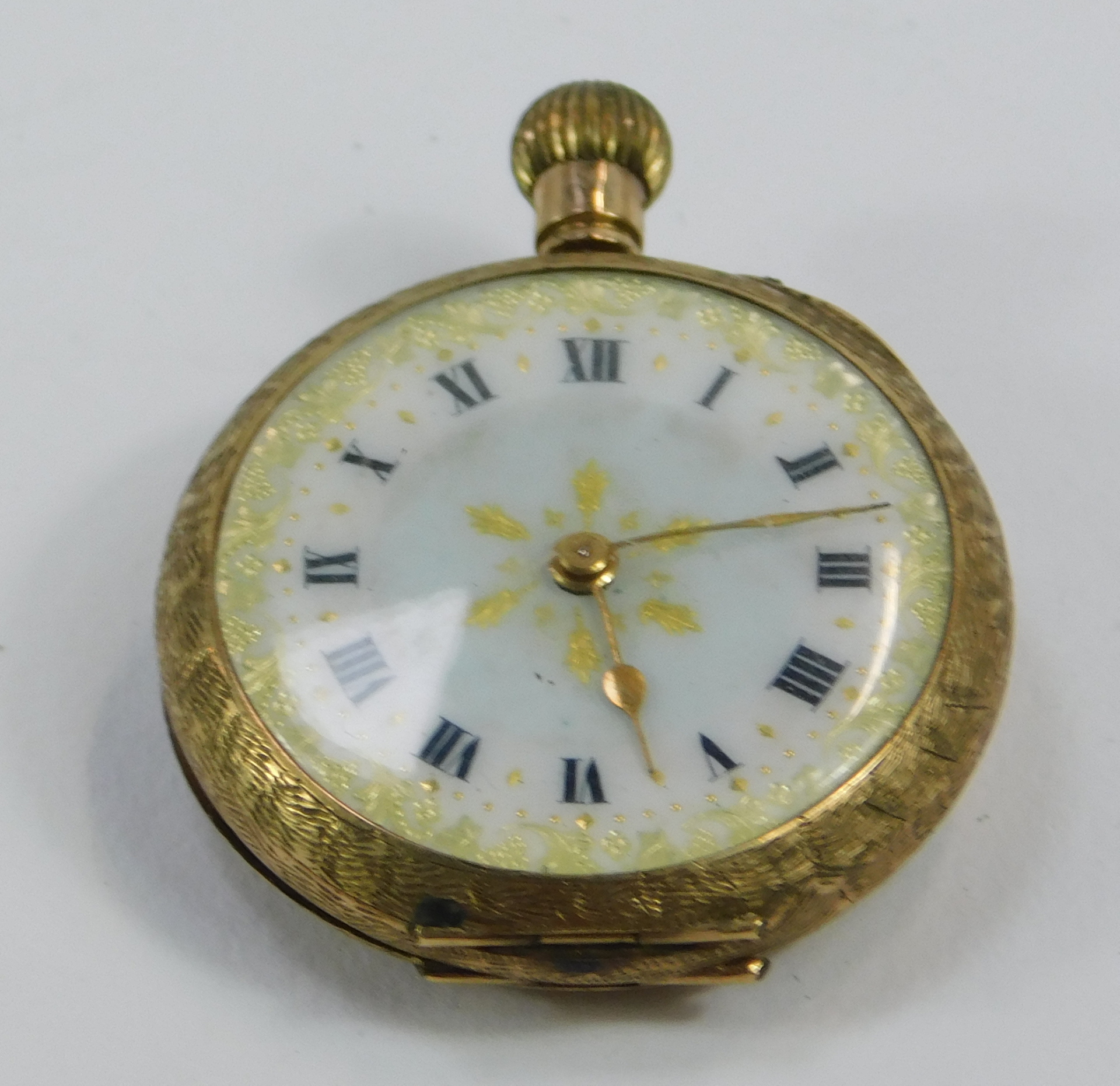 A 9ct gold fob watch, with heavily scroll design case and a vacant shield, with a white enamel Roman - Image 2 of 4