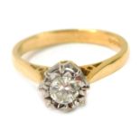 An 18ct gold and diamond solitaire ring, with illusion set round brilliant cut diamond totalling app