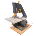 A Burgess BK3+ tabletop band saw. WARNING! This lot contains untested or unsafe electrical items.