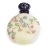 An Edwardian opaque glass scent bottle, with silver cap and stopper, marks indistinct, the glass dec