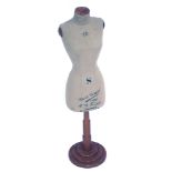 A RD Franks of London small dress makers bust, on a stained pine base, with taupe coloured material