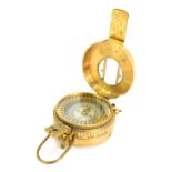 A replica WWII brass compass, stamped to underside T G Co Ltd, London, Mk III 1941, 8cm diameter.