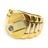 An 18ct gold and diamond set gent's signet ring, the oval panel of bicolour design with gold, rose g