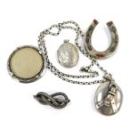 A group of Victorian and later silver jewellery, comprising a buckle locket pendant, horseshoe brooc